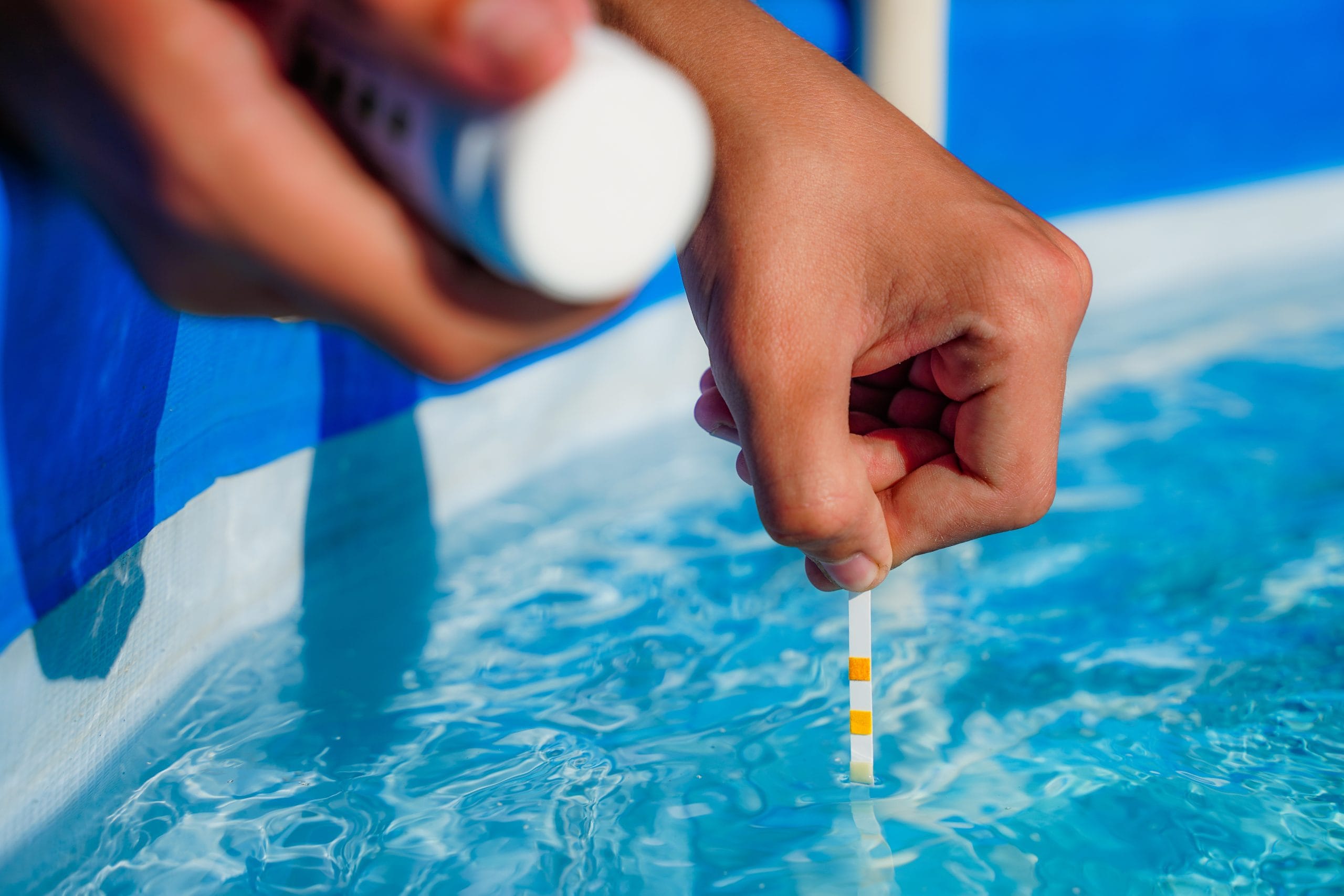 Checking,The,Water,Quality,Of,A,Pool,With,The,Help Regular Water Testing